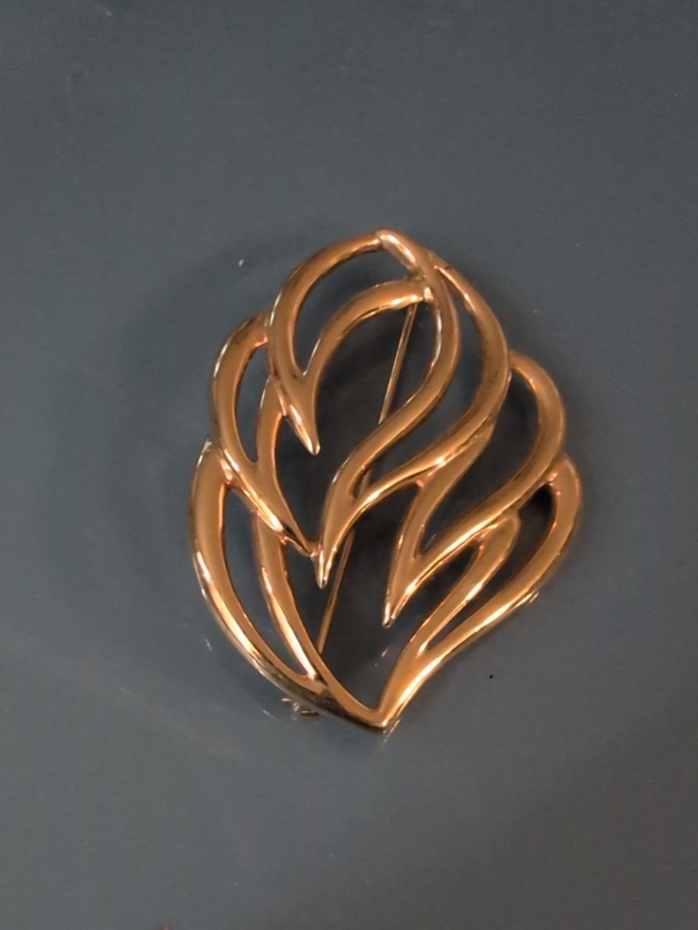 Vintage Monet Gold Tone Swirl Leaf Brooch